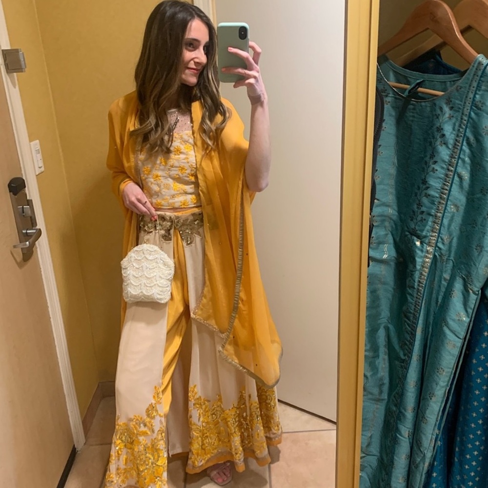 Embroidered yellow Indian wedding outfit. Blouse, pants, skirt, and dupatta